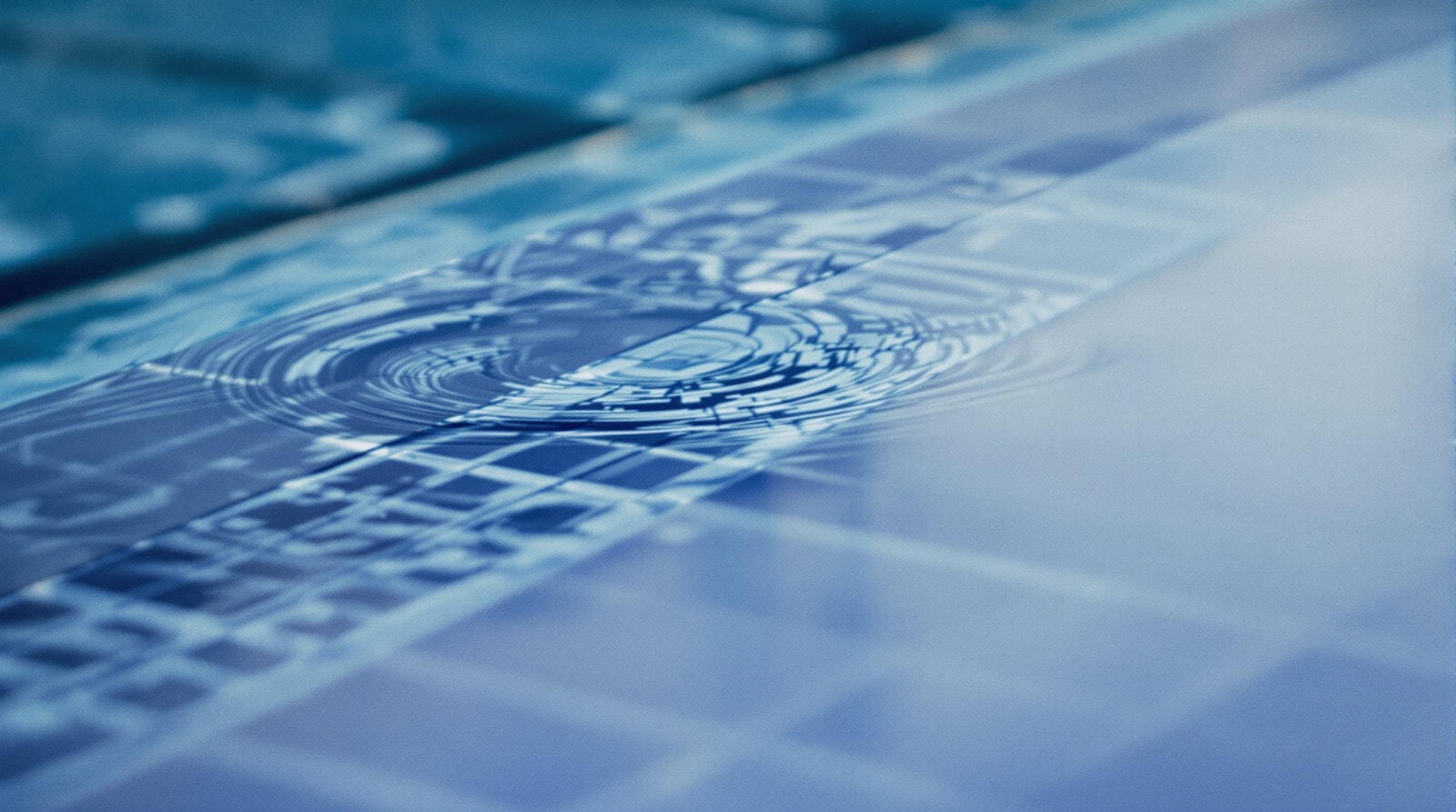 Pool water surface at the tiled waterline showing a faint surface film