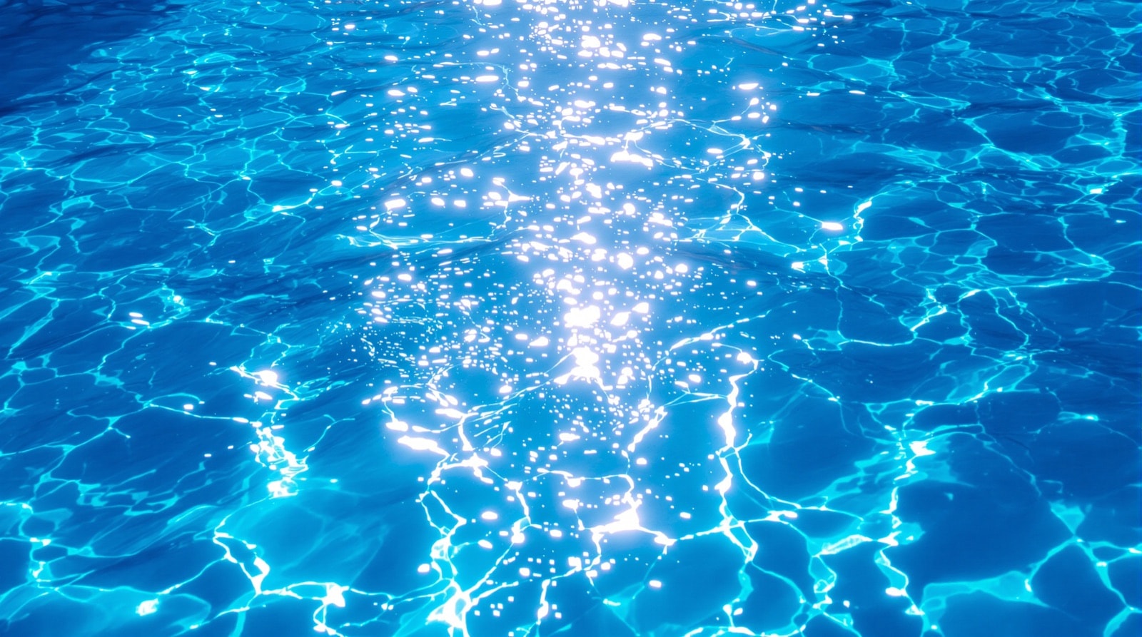 Strong midday sunlight on a pool surface, the condition that destroys unstabilised chlorine